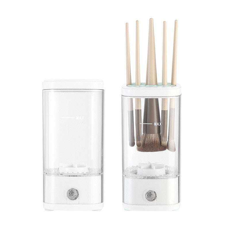 Automatic Makeup Brush Cleaner in white plastic with clear water reservoir and several makeup brushes inserted for cleaning