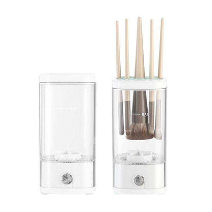 Automatic Makeup Brush Cleaner in white plastic with clear water reservoir and several makeup brushes inserted for cleaning
